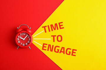 Alarm clock and phrase TIME TO ENGAGE on color background, top view