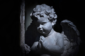 Little angel praying. Black and white style (concept children's mortality, depression)