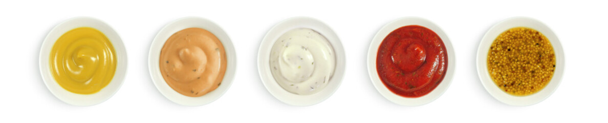 Collection of various sauces in white ceramic bowl top view. Mustard, burger sauce, tartar, ketchup isolated on white background.     