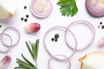 Flat lay composition with cut onion and spices on white background