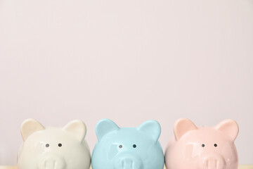 Piggy banks on light background