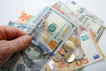 A composition with various country banknotes and coins.