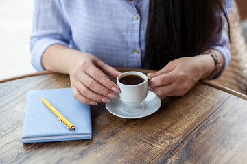 woman hand coffee and notepad