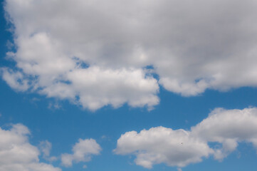 White clouds on a blue sky. Beautiful natural background.