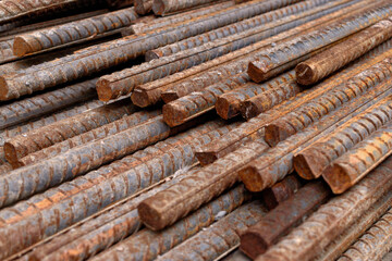 Stack of rusty iron rods or bars. Old metal rusty or steel rod.