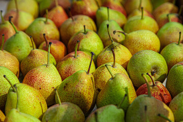 Green pears with red dots on them