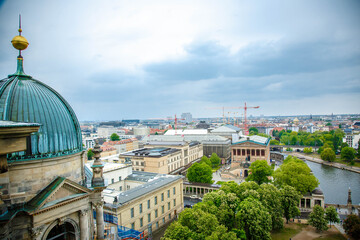 Obraz premium The Berlin cathedral and Fernsehturn television tower stand side by side as respected icons of the city. Perspective corrected panorama detailed when viewed large.