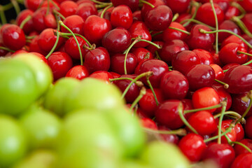 Red sweet cherries in the stock of a market