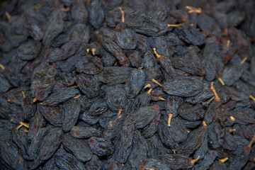 Dried black sultanas in the grocery stock