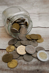 coins in a glass jar. saving money concept