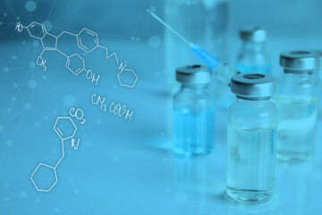 Vaccine and syringe on table. Covid-19 prevention