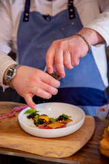 Chef cooks beef tartar. Master class in the kitchen. The process of cooking. Step by step. Tutorial. Close-up