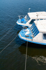 Fototapeta premium Deck two ships. Fragment of the deck of river pleasure boats. Water river transport.