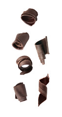 Set with yummy chocolate curls falling on white background