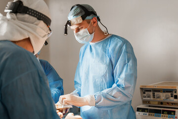 Surgeon open box and takes silicone implant. Chest augmentation plastic operation and correction in...