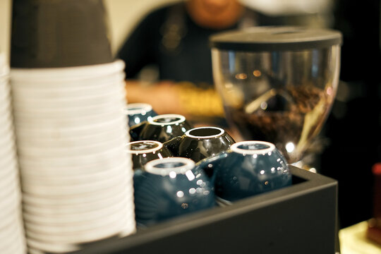 Coffee Beans Inside Coffee Grinder At Local Coffee Shop