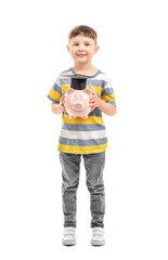 Little boy with piggy bank on white background. Concept of savings for education