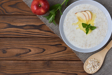 Breakfast: oatmeal with butter and apples. View from above.
