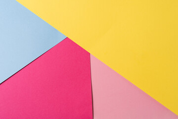 Pink,blue and yellow colored abstract paper , with geometric shape for using as background.