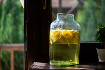 homemade syrup of elderberry flowers in a glass jar