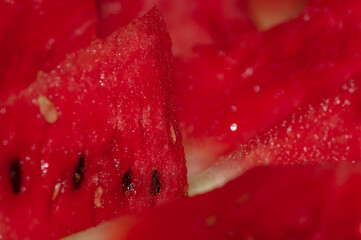 Chunks of the red watermelon with black pips seed
