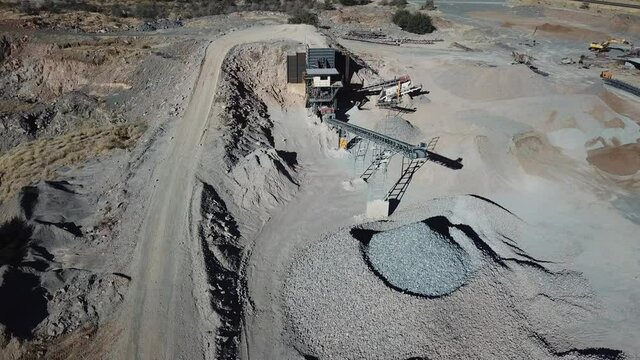 4K aerial drone video of African savanna hills, stone quarry near granite boulders range at B1 highway south of Windhoek in central highland Khomas Hochland of Namibia, southern Africa