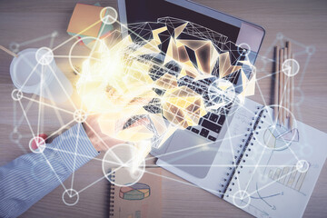 Double exposure of man's hands typing over computer keyboard and brain hologram drawing. Top view....