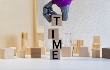 the concept of time. hand men in business suit holding the cubes which the written word time.
