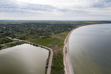 Fototapeta na wymiar Beautiful aerial view of spit in river on cloudy day