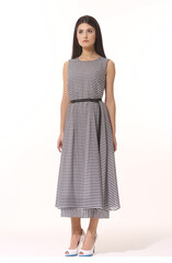 Fototapeta premium business woman executive posing in formal striped long skirt summer dress