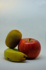 Composition of apple, banana and kiwi.