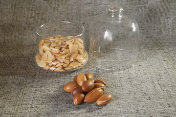 whole and peeled argan nuts, close up