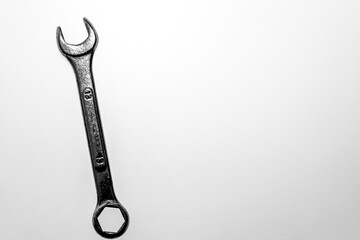 A wrench on a white bakground