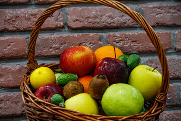 Mixed exotic fruit basket in brick background