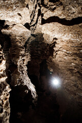 Dark Tunnel Cave has nobody. Tourist route, tours, adventures and interesting places. inside ancient crystal formations, stones, geology, explore of rocks of the soil. village Mlynky . Ukraine