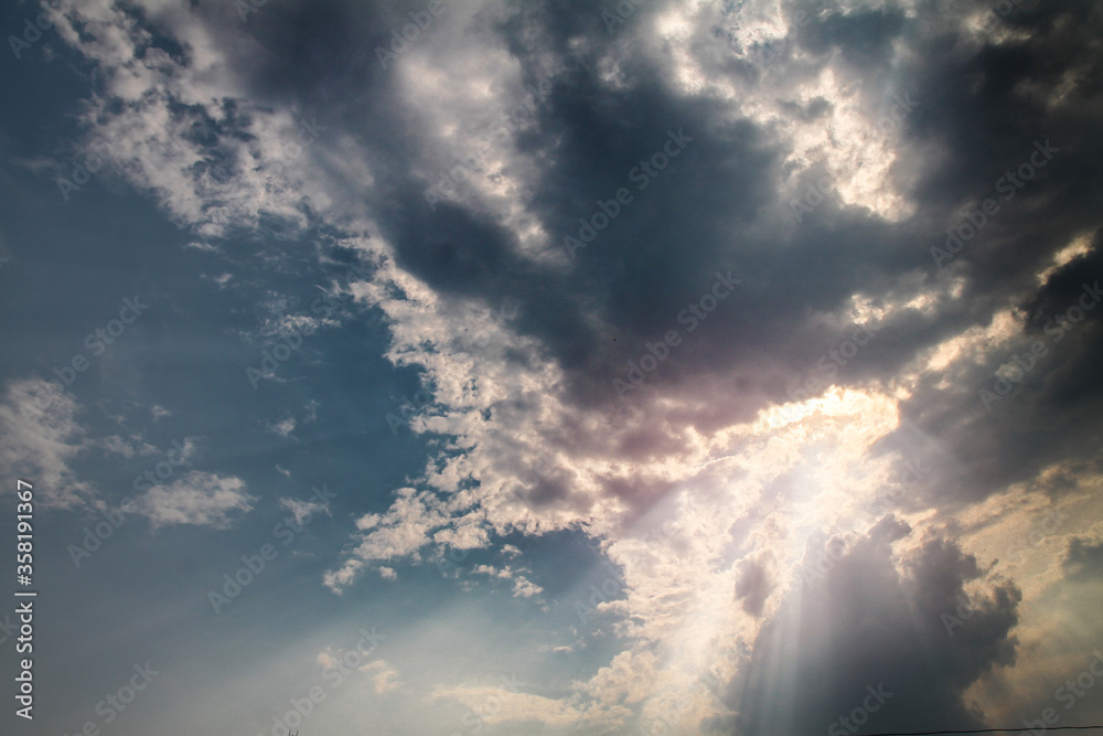 Wall mural picturesque clouds in the sky. window view of an airplane on a sunny gloomy day. stock photo backgro