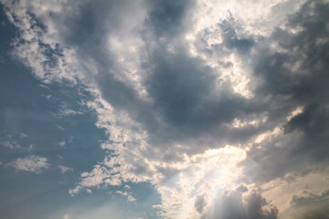Picturesque clouds in the sky. Window view of an airplane on a sunny gloomy day. Stock photo background