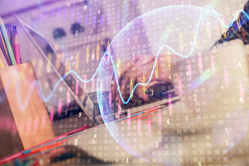 Double exposure of woman hands typing on computer and forex chart hologram drawing. Stock market invest concept.