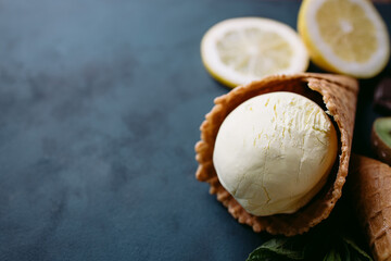 Waffle cones with exotic lemon and kiwi ice-cream, close up. Delicious refreshing tropical sweets, seasonal sweets for summer