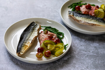 Grilled mackerel with gooseberry ketchup, pickled cucumber and whole gooseberries and samphire