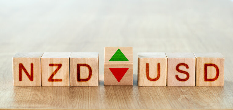 nzd usd concept. wooden blocks with the names of trading instruments in the foreign exchange market