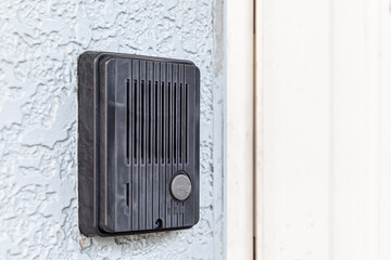 Close - up at Security intercom button in the apartment door