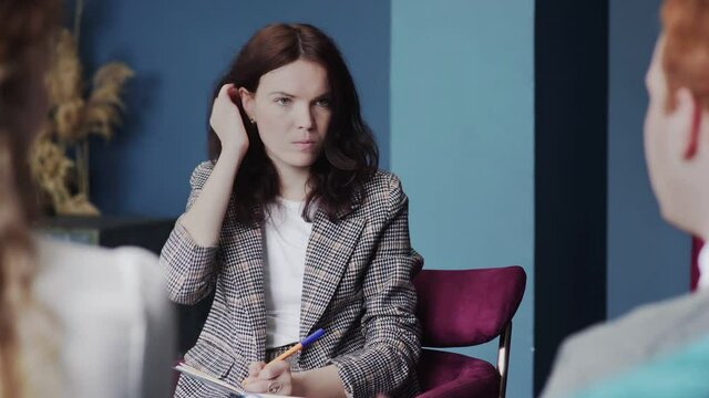 Femaly psychologist at work. Psychologist with the patients.