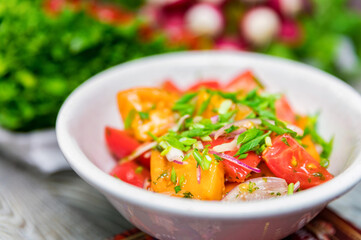 Fresh rustic vegetable salad on rustic background