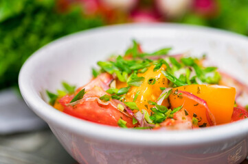 Fresh rustic vegetable salad on rustic background
