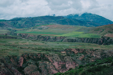 Naklejka premium Photo of mountain landscape with clouds.
