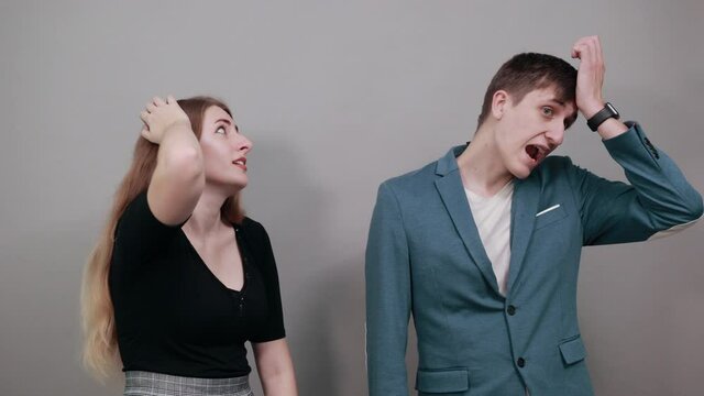 Face palm, disappointed slapping head due to mistake, oversight or epic fail, headache in studio, forgetful model remembers do importent task, keeps hand on forehead, remembering important forgets