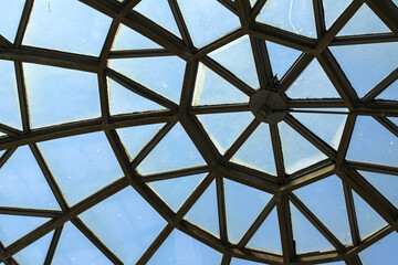Glass dome construction of a building roof. Interesting ancient architecture. Stock abstract background.