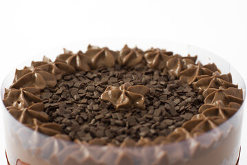 Chocolate cake with granulated topping isolated on center