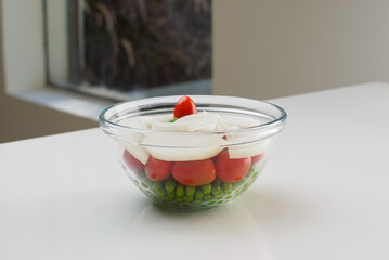 Organic onion salad with cherry tomatoes and peas
